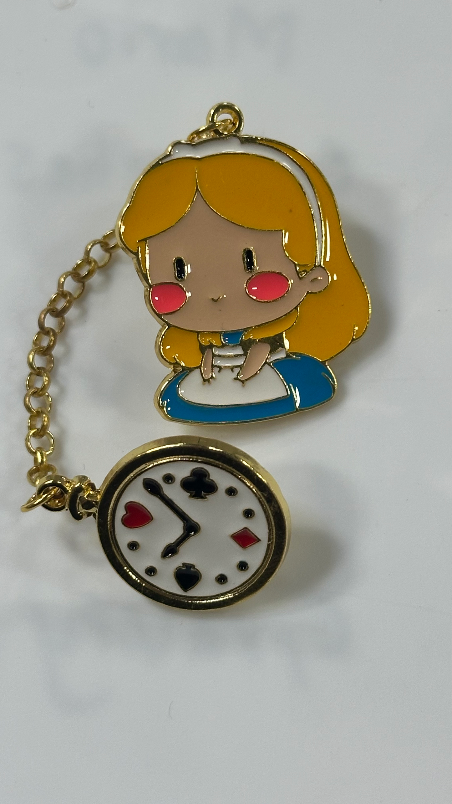 Metal Pin - Little Blonde Princess Attached to a clock