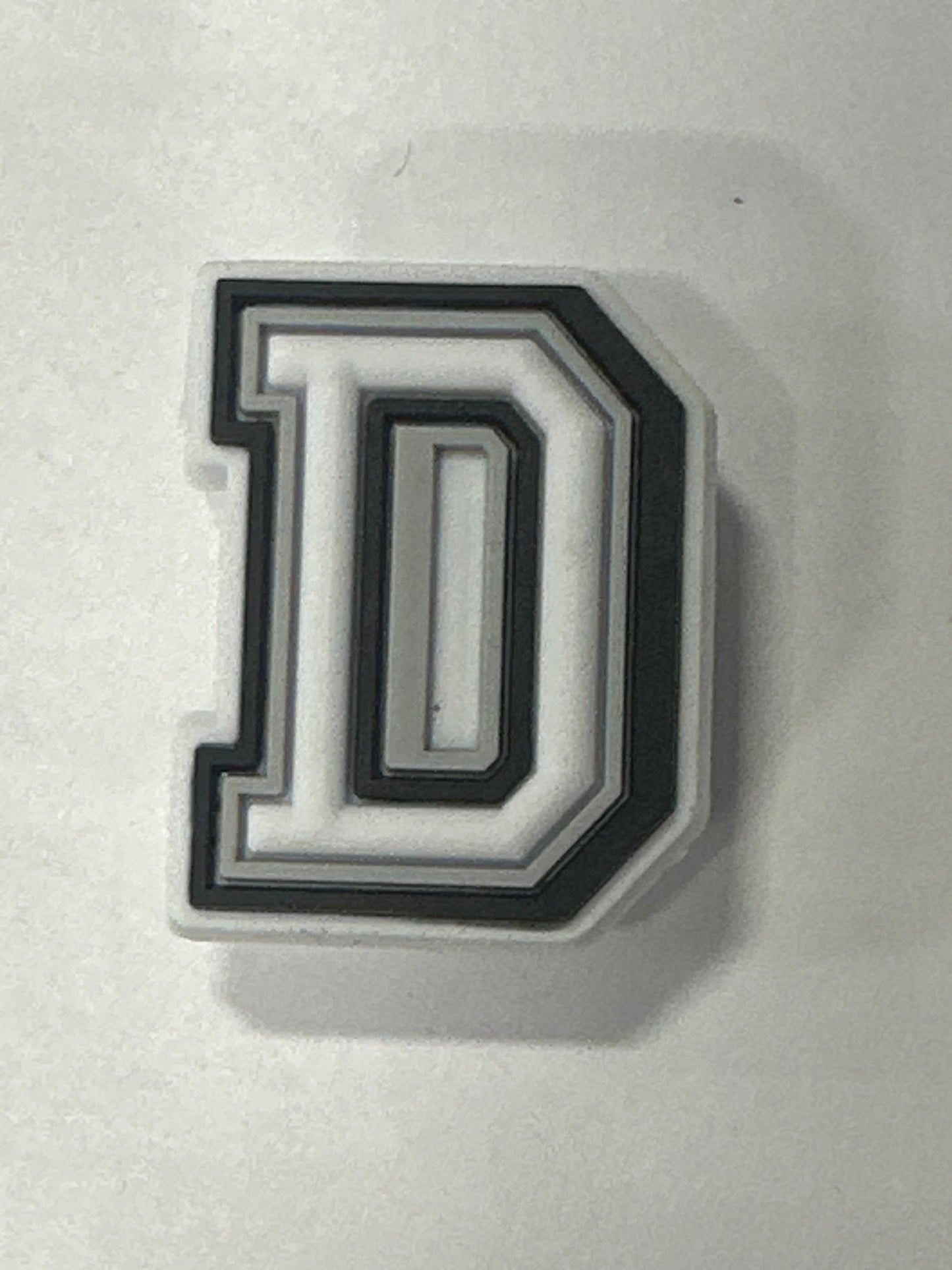 White Letter D