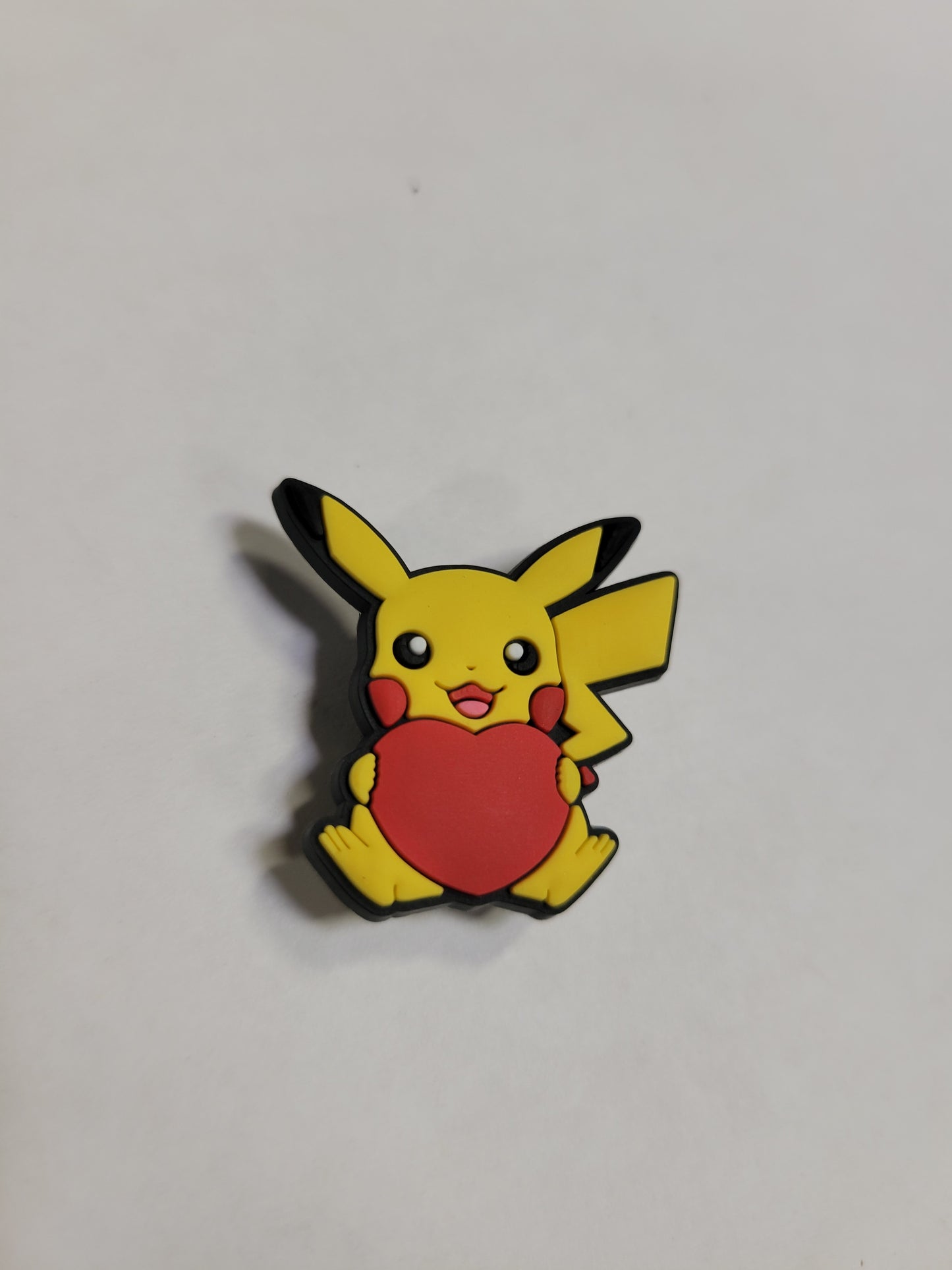 Pikachu holding a Heart Charm (Pokemon)