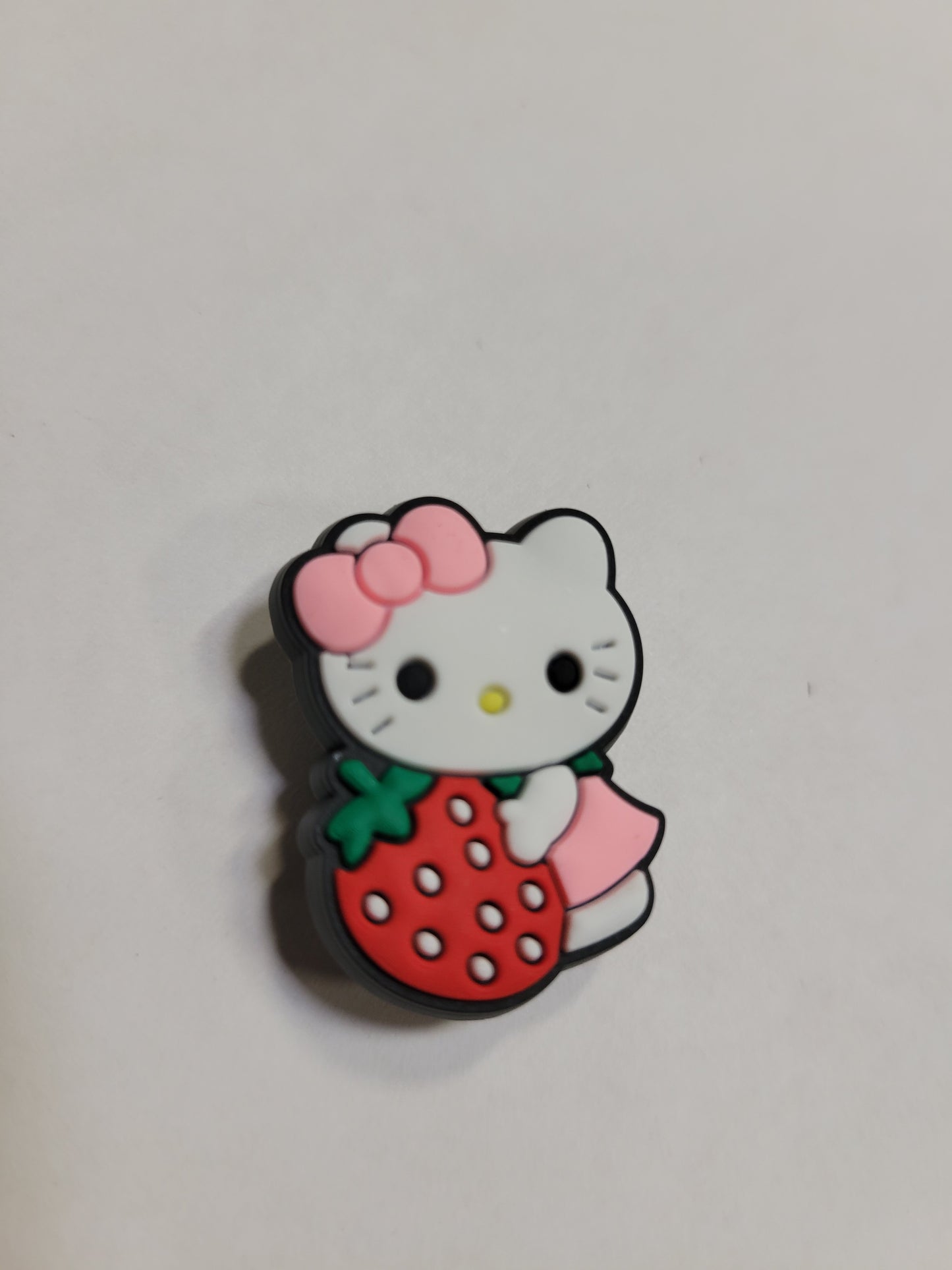 Hello Kitty Holding a Strawberry Charm